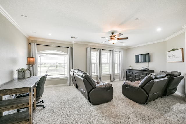 living room featuring crown molding, ceiling fan, and carpet floors