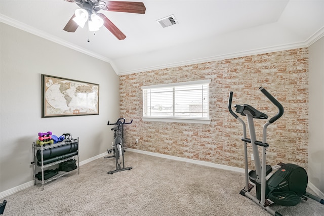 workout room with ornamental molding, lofted ceiling, ceiling fan, and carpet flooring