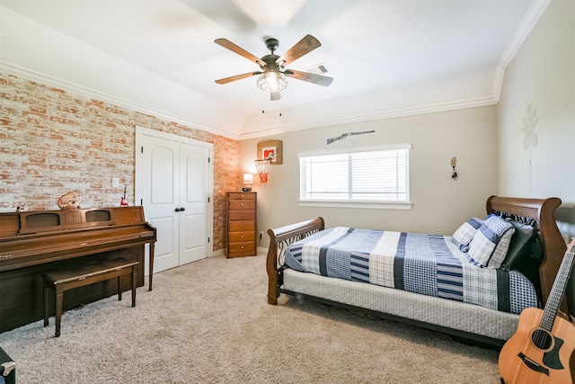 bedroom featuring crown molding, light colored carpet, and ceiling fan