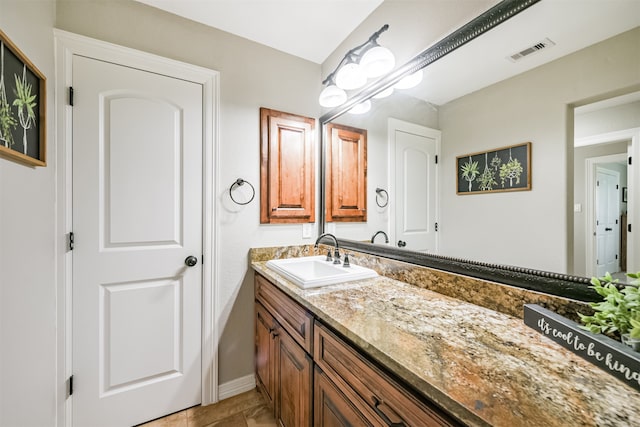 bathroom with vanity and tile patterned floors