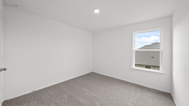 empty room featuring carpet floors