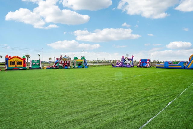 view of jungle gym with a lawn