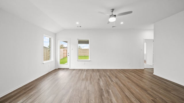 unfurnished room featuring lofted ceiling, ceiling fan, and dark hardwood / wood-style floors