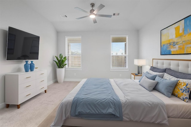 carpeted bedroom featuring ceiling fan and vaulted ceiling