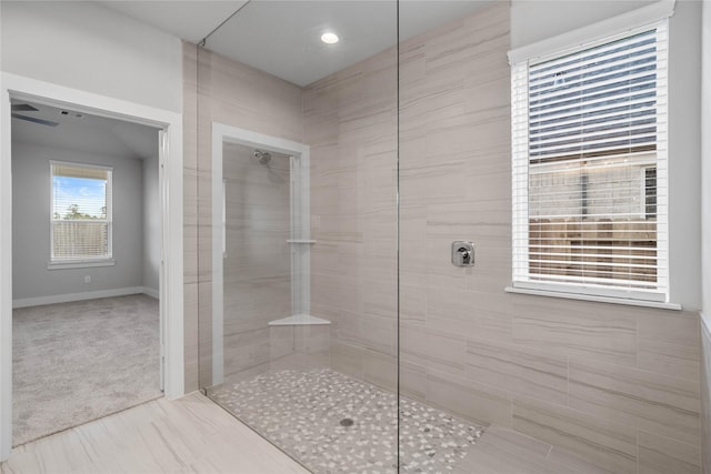 bathroom featuring a tile shower