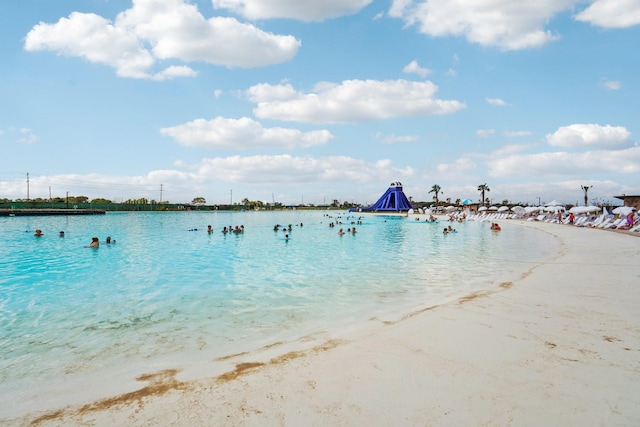 property view of water featuring a beach view