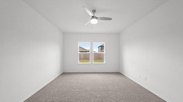 empty room with carpet flooring and ceiling fan