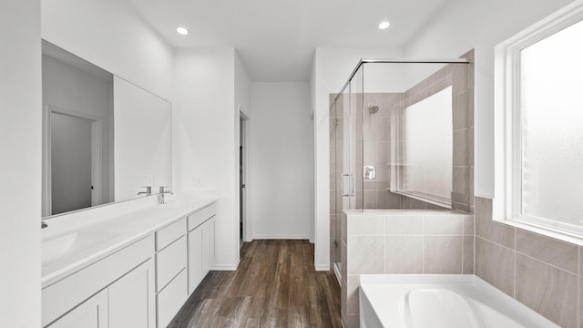 bathroom featuring vanity, hardwood / wood-style flooring, and independent shower and bath