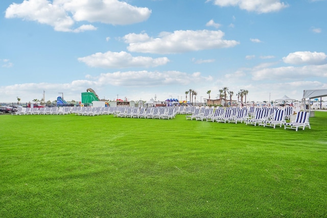 view of home's community featuring a lawn