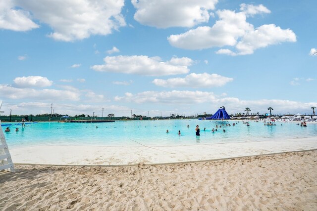 view of water feature with a beach view