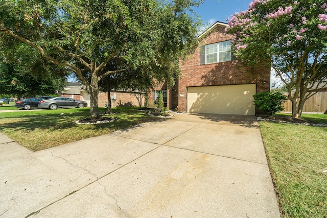 view of front of home featuring a front lawn and a garage