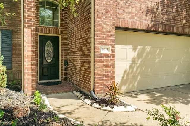 view of exterior entry featuring a garage