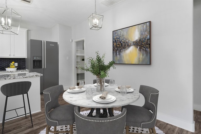 dining space featuring dark hardwood / wood-style flooring