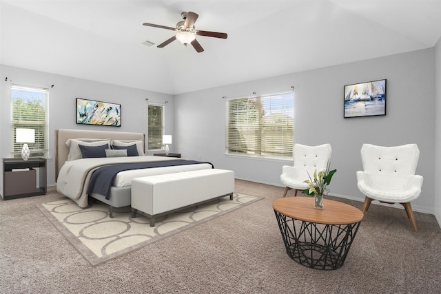 bedroom with light colored carpet, multiple windows, lofted ceiling, and ceiling fan