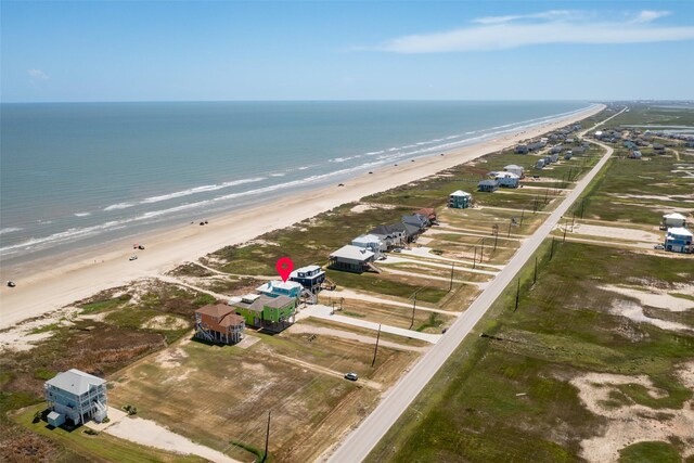 aerial view featuring a water view and a view of the beach