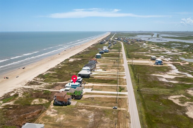 birds eye view of property featuring a view of the beach and a water view