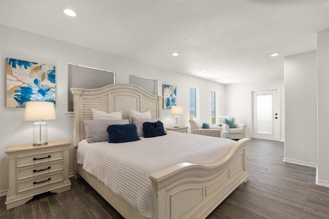 bedroom with dark wood-type flooring