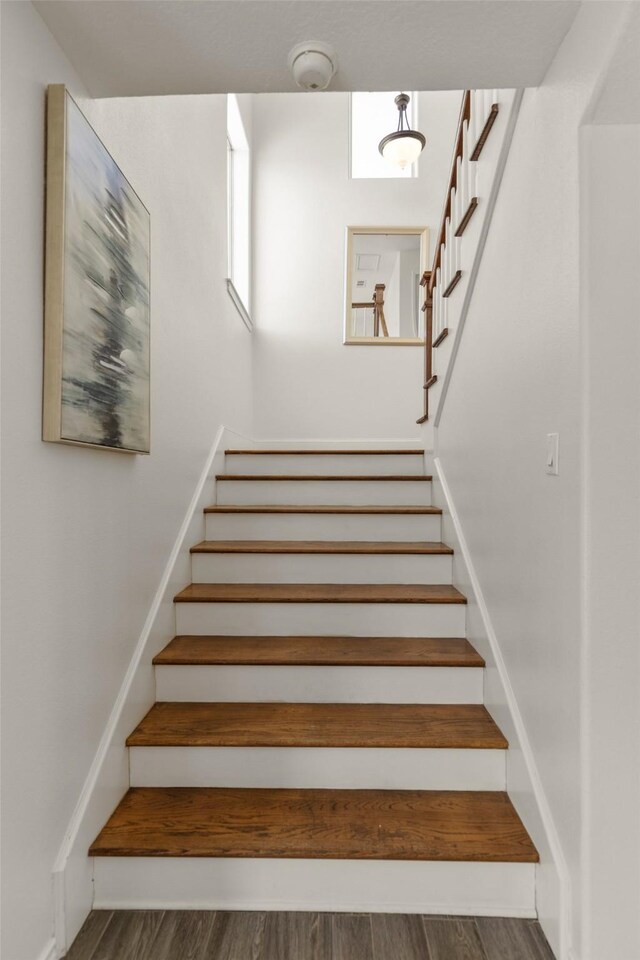 stairs with wood-type flooring