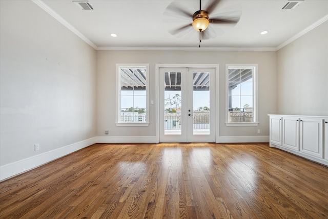 entryway with french doors, ceiling fan, ornamental molding, and wood-type flooring