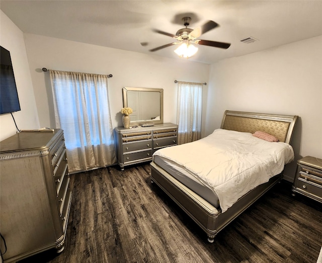 bedroom featuring ceiling fan and dark hardwood / wood-style floors