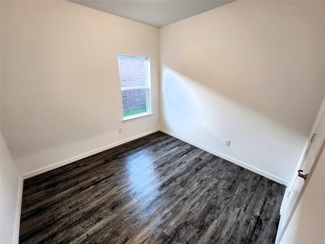 unfurnished room with wood-type flooring