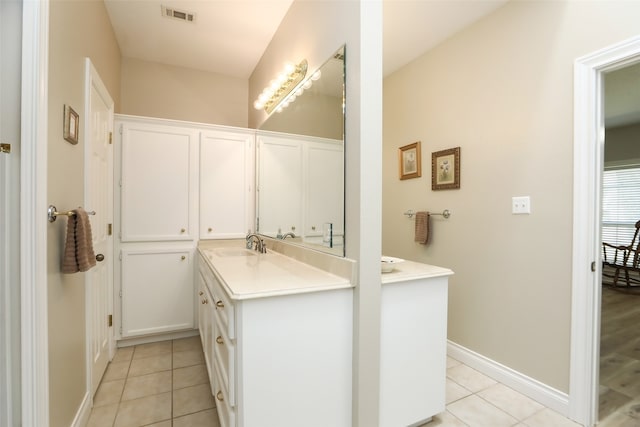 bathroom with vanity and tile patterned flooring