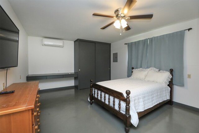 bedroom with a wall unit AC and ceiling fan