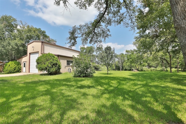 view of yard with a garage