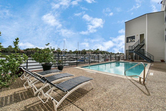 view of swimming pool featuring a patio