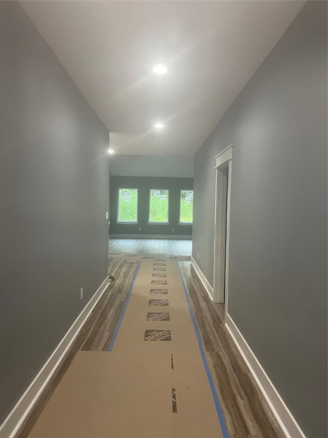 corridor featuring dark wood-type flooring