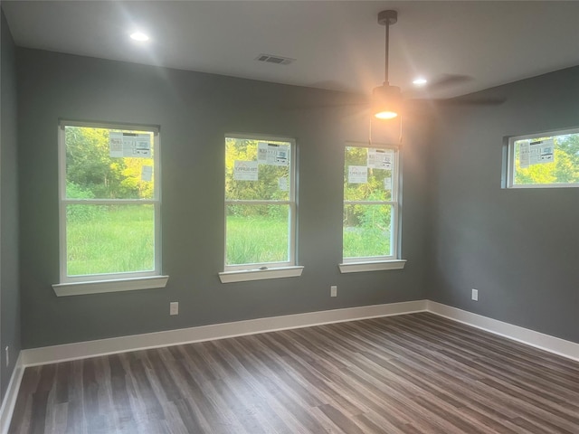 unfurnished room with dark hardwood / wood-style floors