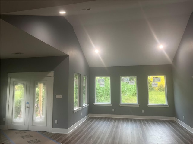 interior space featuring hardwood / wood-style flooring, high vaulted ceiling, and french doors