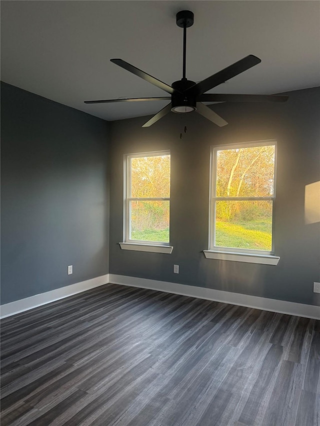 unfurnished room featuring dark hardwood / wood-style flooring and ceiling fan