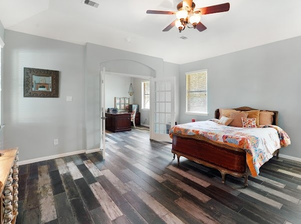 bedroom with ceiling fan, french doors, and wood-type flooring