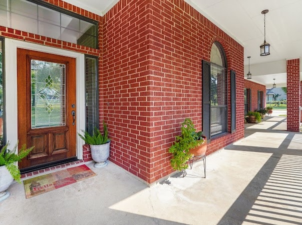 doorway to property with a porch