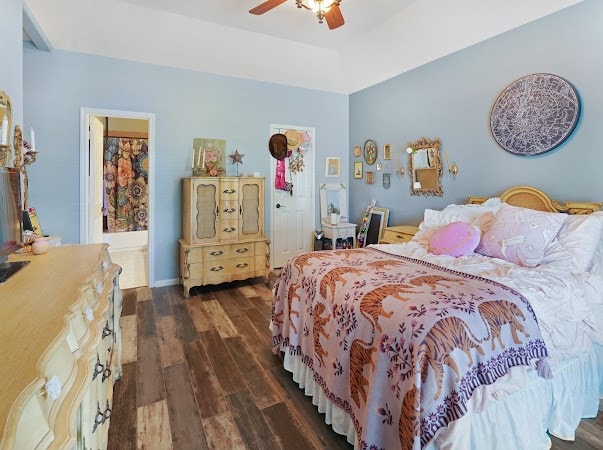 bedroom featuring dark hardwood / wood-style floors and ceiling fan