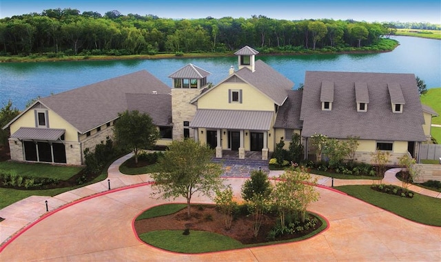 view of front of property with a water view