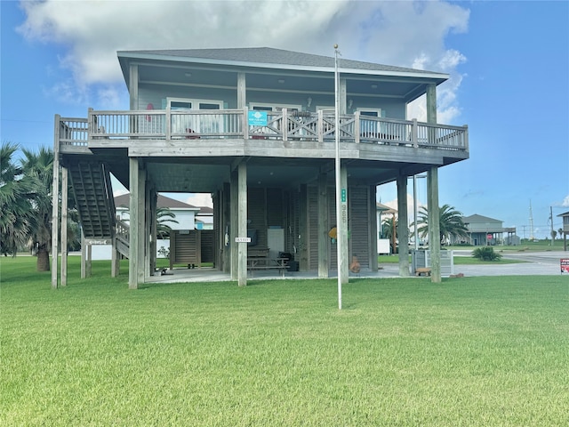 rear view of house with a lawn