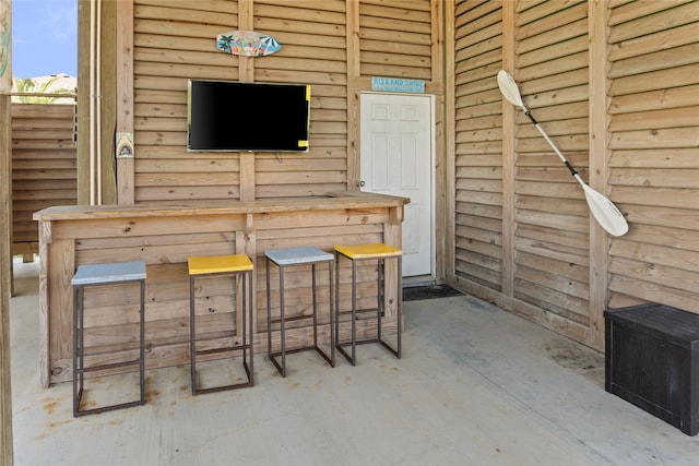 interior space featuring log walls and decorative light fixtures