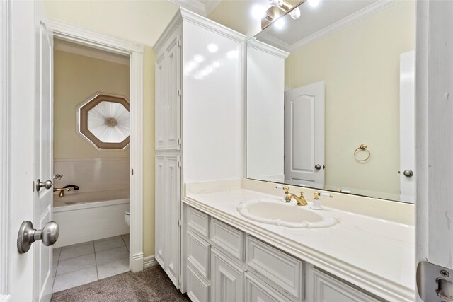 bathroom with toilet, a bath, ornamental molding, tile patterned floors, and vanity