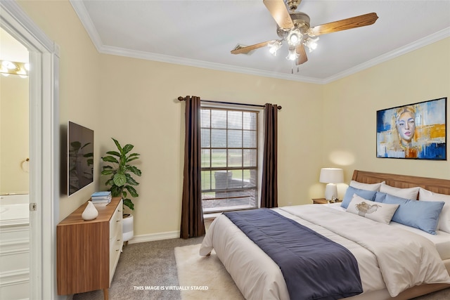 carpeted bedroom featuring ensuite bathroom, crown molding, and ceiling fan