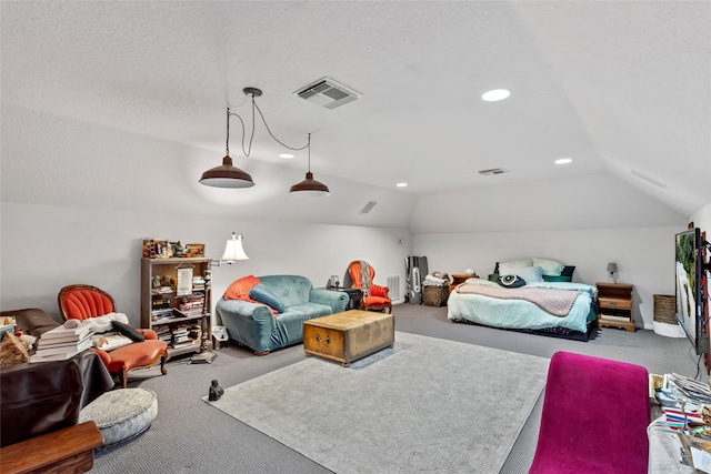 carpeted bedroom featuring vaulted ceiling and a textured ceiling