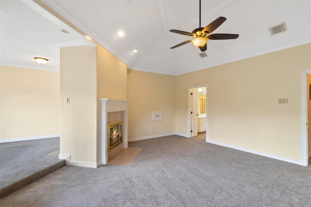 unfurnished living room featuring ceiling fan, vaulted ceiling, light carpet, and crown molding