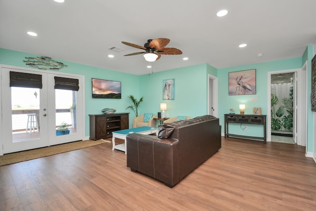 living room with ceiling fan, wood-type flooring, and french doors