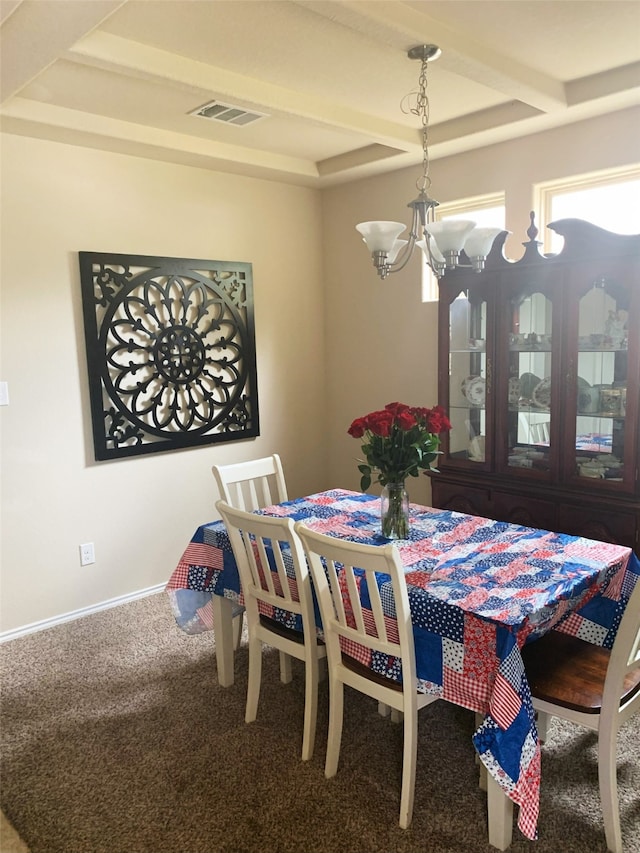 dining area featuring carpet and a notable chandelier