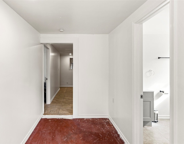 hall featuring light tile patterned floors