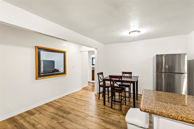 dining room with light wood-type flooring