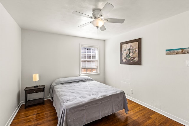 bedroom featuring dark wood-type flooring and ceiling fan