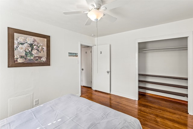 bedroom featuring ceiling fan, hardwood / wood-style floors, and a closet