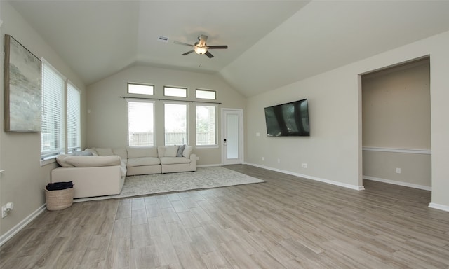 unfurnished living room with ceiling fan, light wood-type flooring, and lofted ceiling